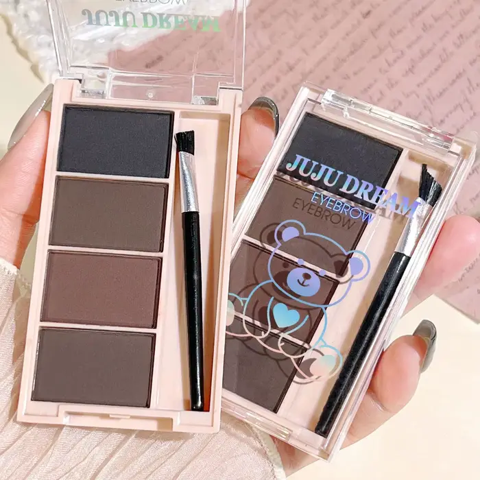 Un ensemble de plateaux de poudre à sourcils de 4 couleurs avec des pinceaux en tons gris et marron mat pour un rendu